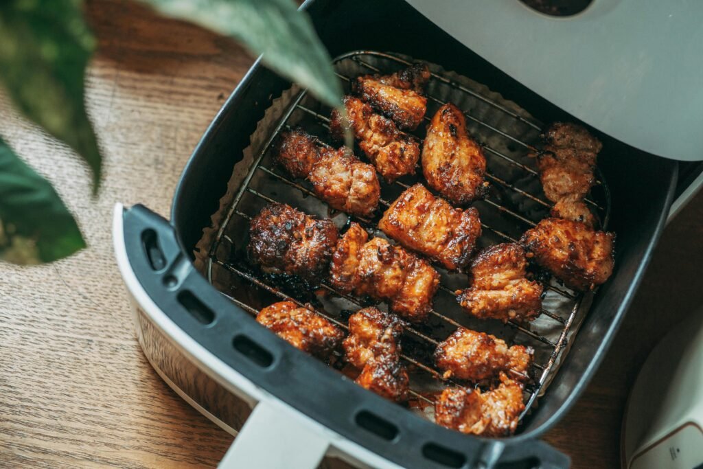 Delicious crispy chicken pieces cooked perfectly in a modern air fryer, ready to serve.